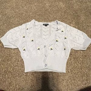 Blue cropped cardigan with yellow flowers